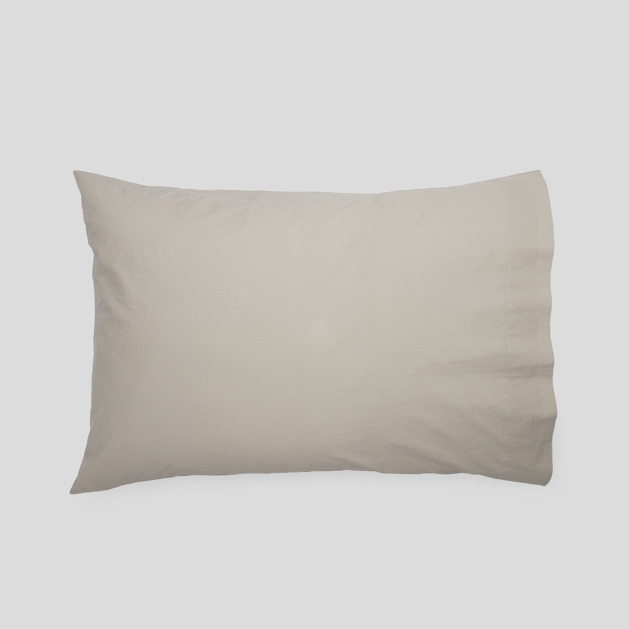 Sand organic cotton pillowcase for elegant bedding and modern interiors.