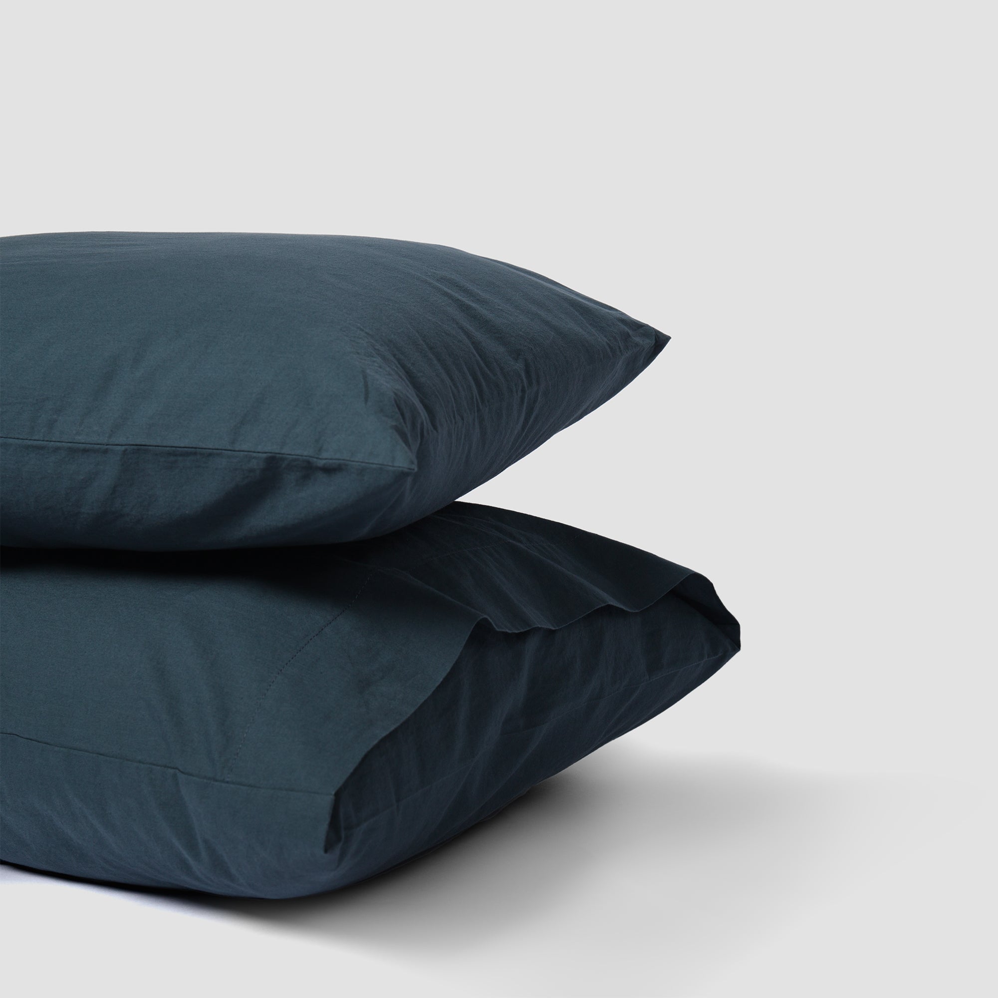Set of two atlantic blue pillowcases in organic cotton for a serene bedroom feel.