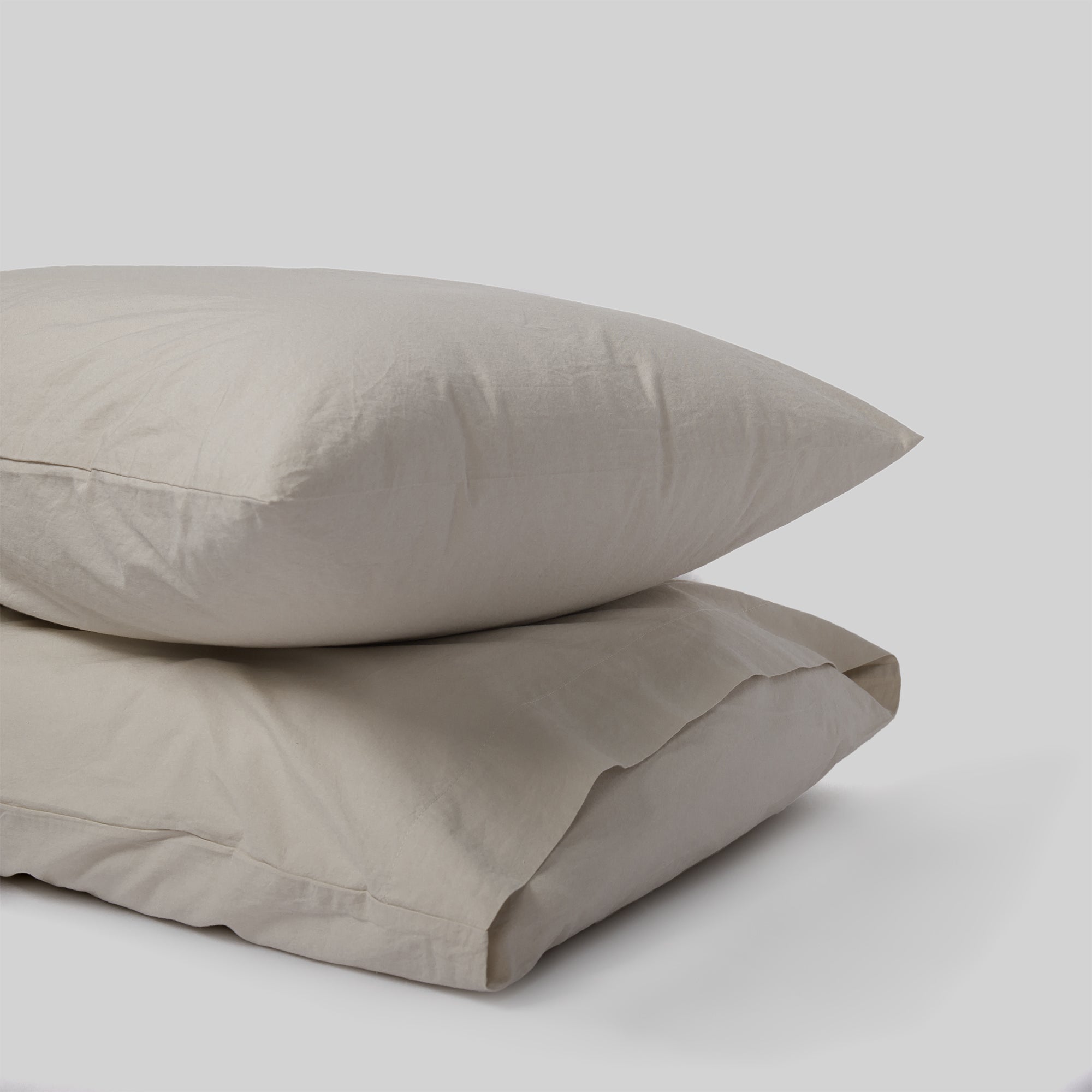 Set of two sand pillowcases in organic cotton for a serene bedroom feel.