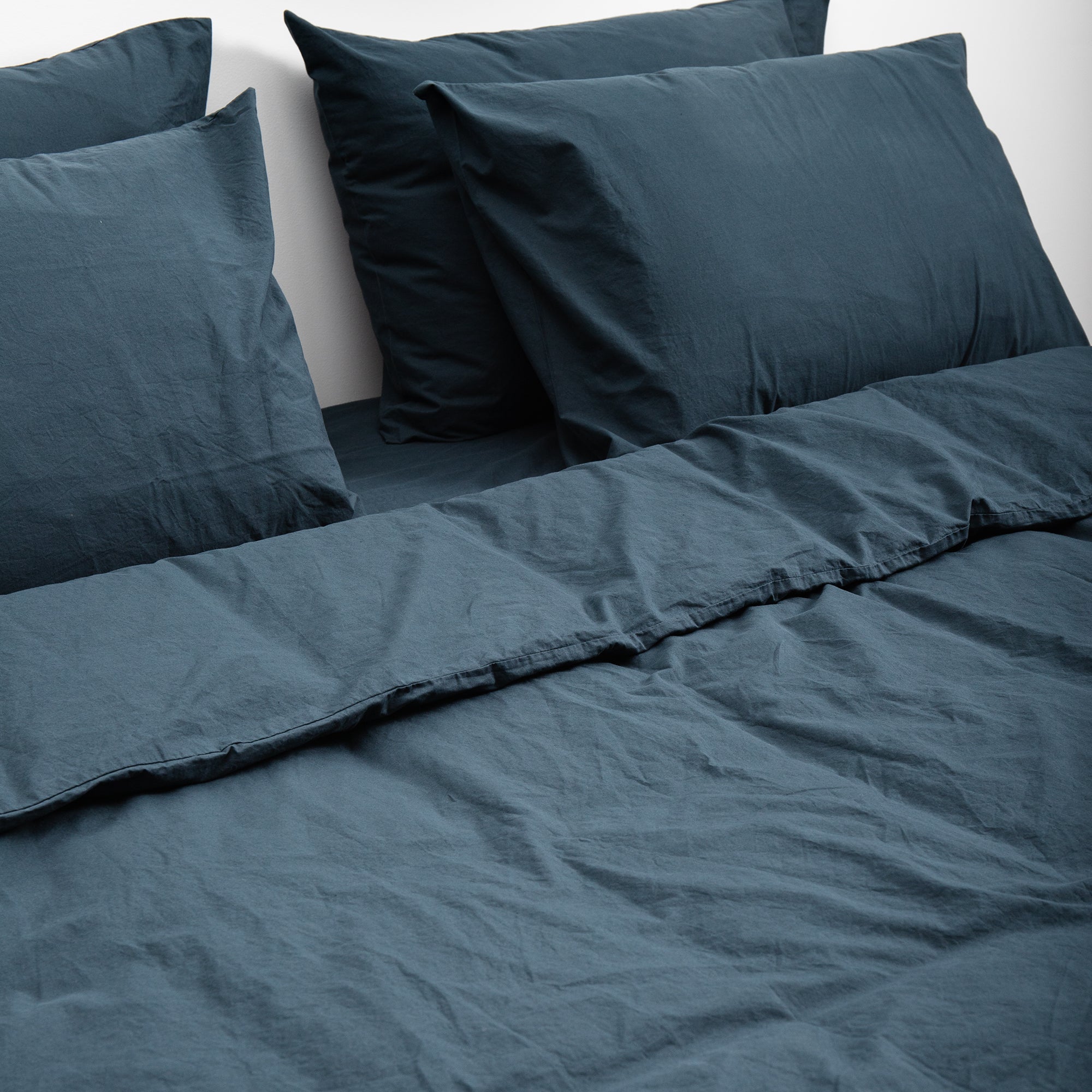 Duvet cover set with matching pillowcases styled in a layered contemporary bedroom setting.