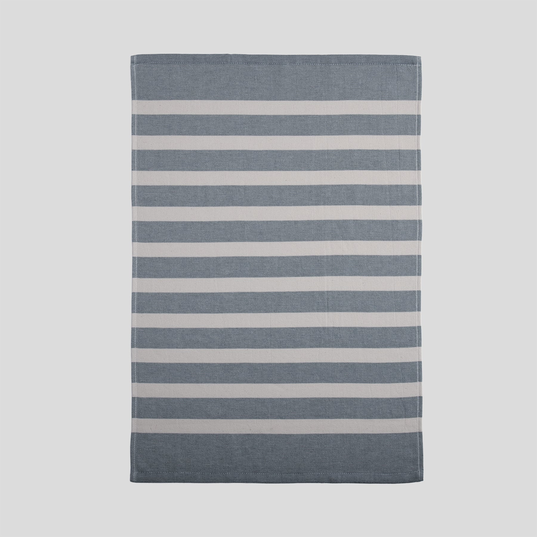 Cotton kitchen towel in blue with a smooth front and horizontal stripe pattern.